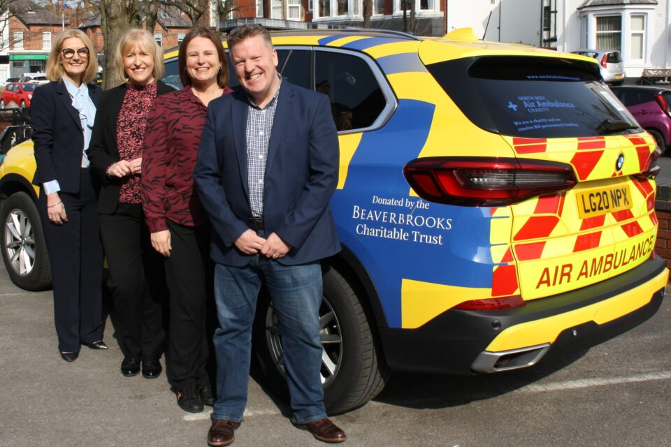 Beaverbrooks and North West Air Ambulance staff in front of the new critical care car