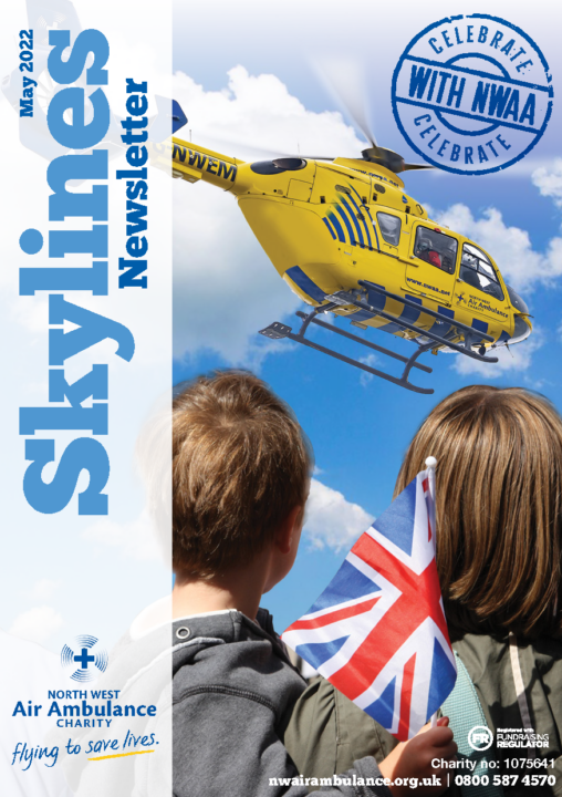 image of the font cover of Skylines including two children holding the Union Jack flag looking at the NWAA helicopter flying above in the clouds