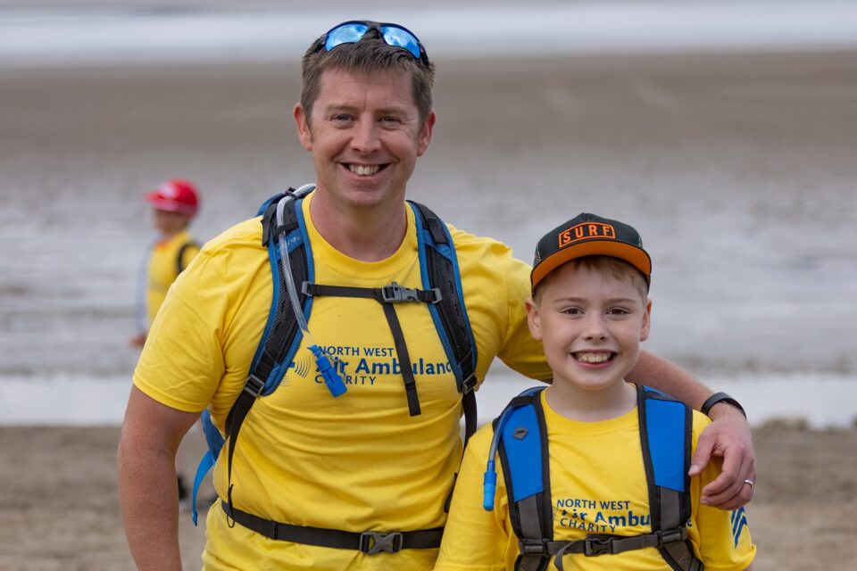 David Lambert taking part in the Cross Bay Walk 2021 with his son Christopher