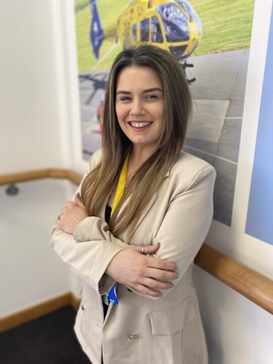 Supporter Engagement Assistant Lauren in the International Womens Day pose for 2023