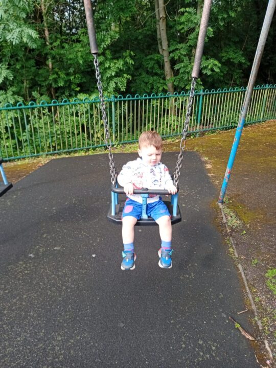 Henry on the swings 