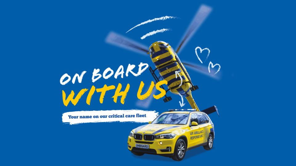 A promotional graphic featuring a yellow air ambulance helicopter and response car on a bright blue background. White text reads ‘On Board With Us’ with the tagline ‘Your name on our critical care fleet.’ The design includes hand-drawn white heart doodles and arrows, promoting support for the North West Air Ambulance Charity.